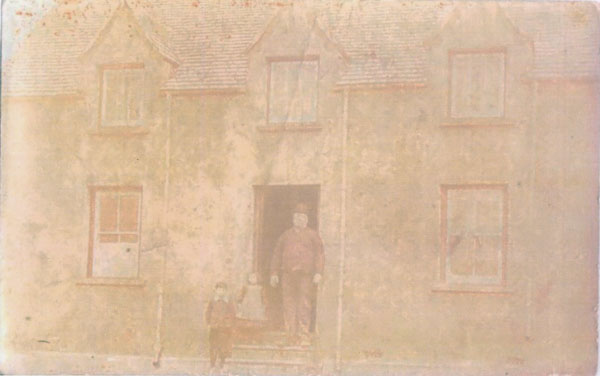 Copy of a photograph of a man and two children one girl and one boy. Unnamed possibly Georgie Palmer (adult) and undated